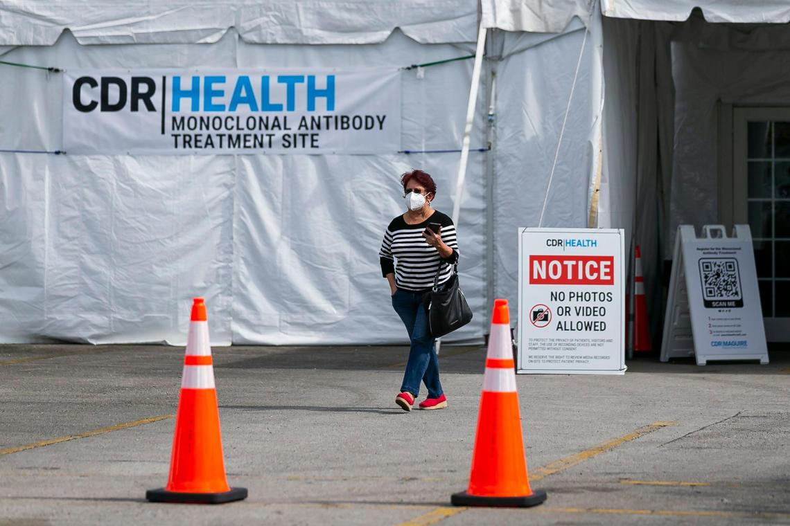 A woman can be seen leaving a monoclonal antibody treatment site for COVID-19 at Miami Dade College North Campus in Miami, Florida on Wednesday, January 19, 2022.