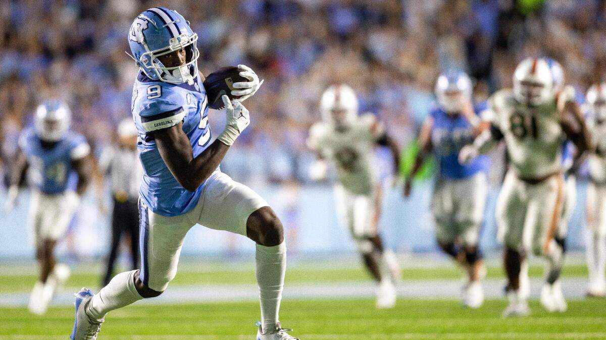 North Carolina wide receiver Devontez Walker (9) scores on an 33-yard pass completion from quarterback Drake Maye to give the Tar Heels a 28-17 lead in the third quarter against Miami on Saturday, October 14, 2023 at Kenan Stadium in Chapel Hill, N.C.
