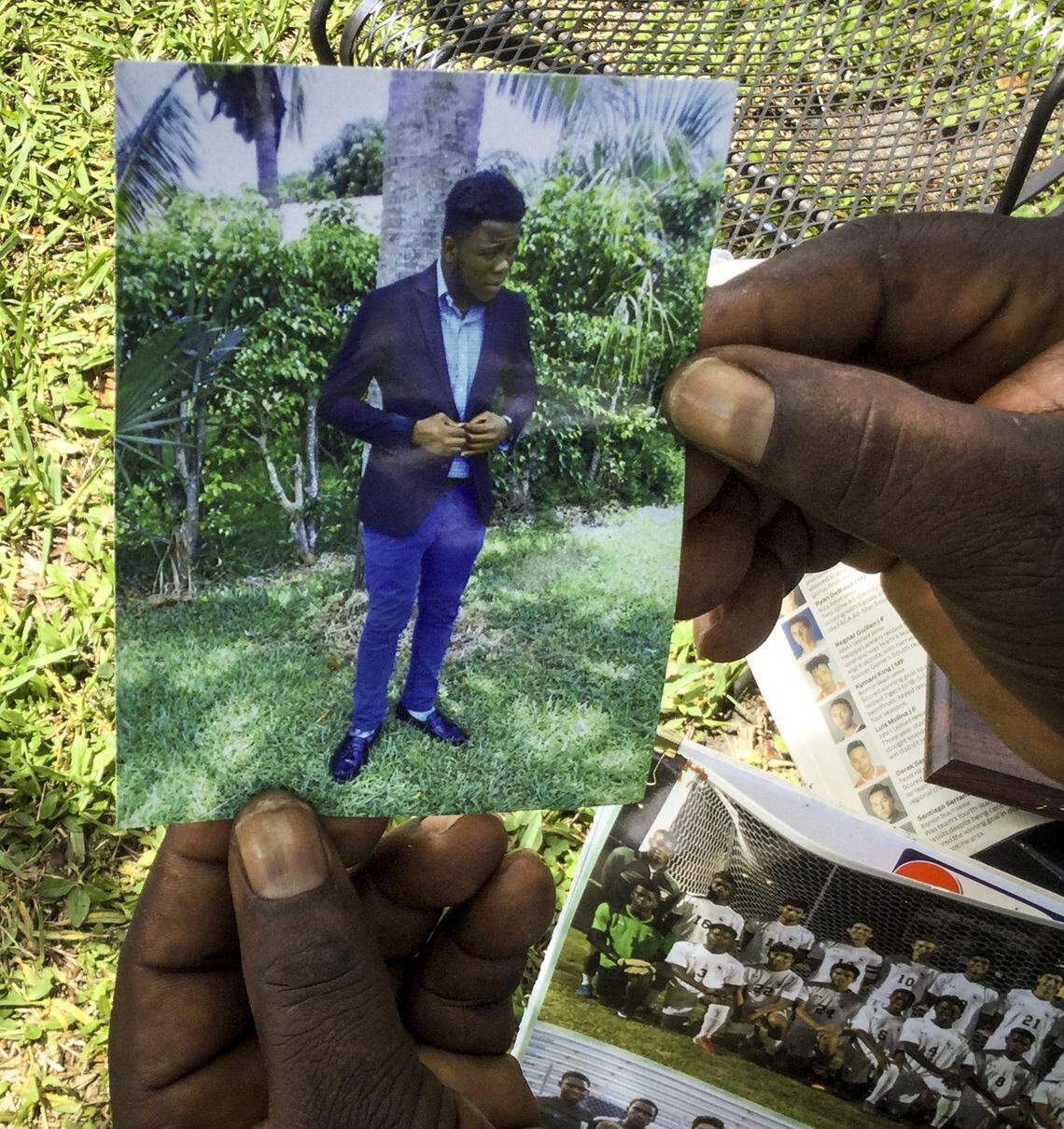 Calice Nalus, 57, of Delray Beach, shows a photo of son Lonelson, 25. He and two brothers left South Florida for an eight-day vacation in the Dominican Republic on July 29, 2020. Nearly a year later, they are still detained after being arrested on what the men say are false allegations of drug trafficking. Lonelson Nalus, a U.S. citizen born in Haiti, has pleaded to the U.S. government for help but so far gotten no response.
