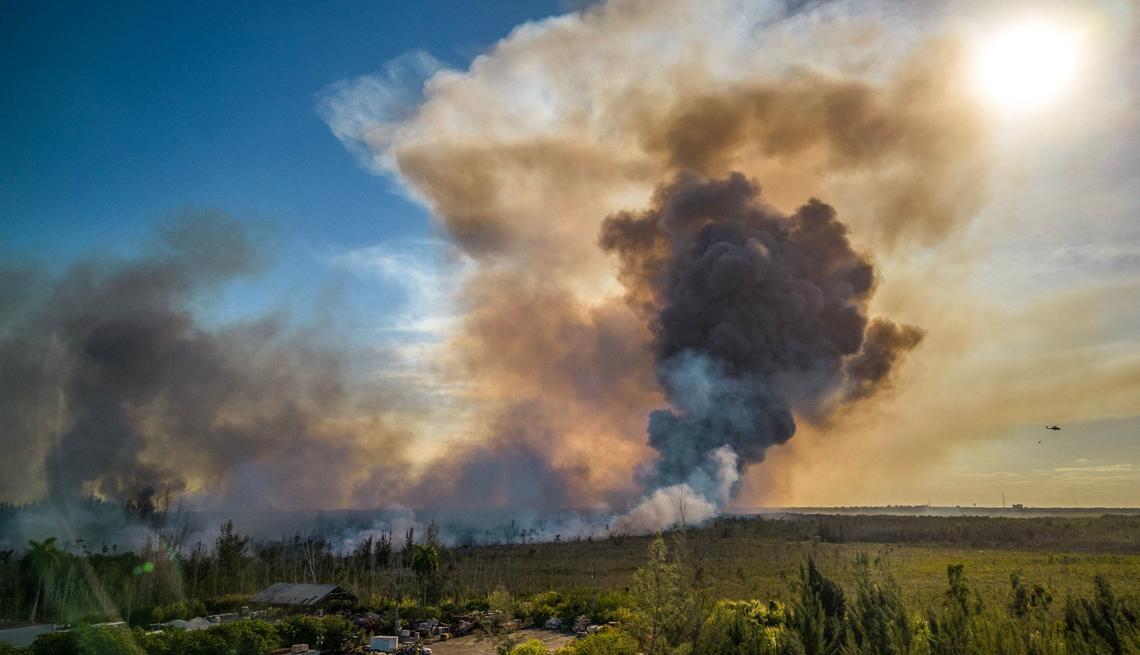 View of heavy smoke caused by a grass fire in the SW 137 Avenue and 8 Street area in Miami, on Sunday, April 14, 2024.
