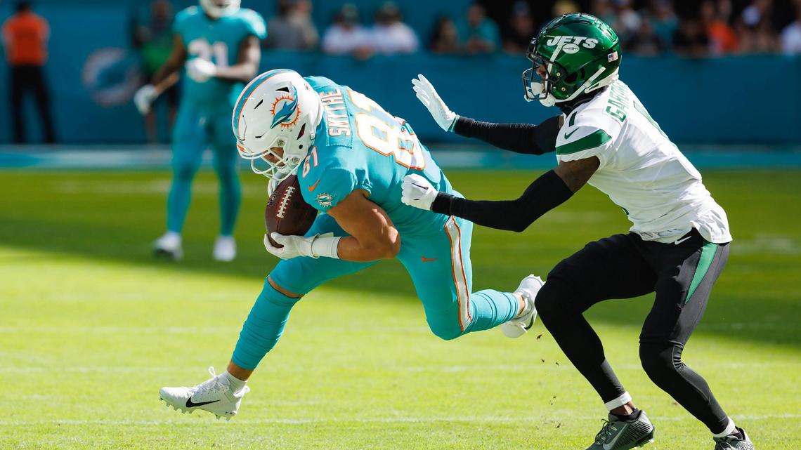 Miami Dolphins tight end Durham Smythe (81) catches a pass against New York Jets cornerback Sauce Gardner (1) during first quarter of an NFL football game at Hard Rock Stadium on Sunday, January 8, 2023 in Miami Gardens, Florida.