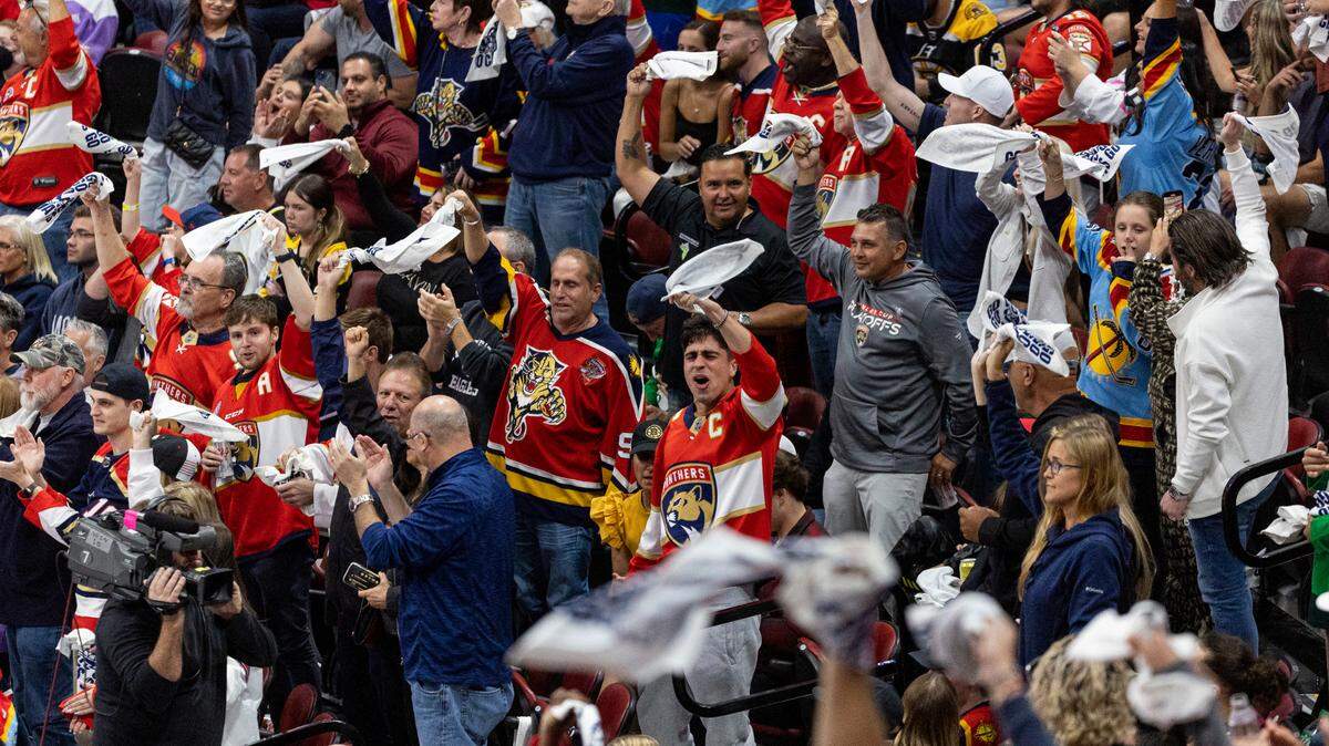 Florida Panthers fans celebrate after their team scored a goal against the Boston Bruins in the third period of Game 6 of a first round NHL Stanley Cup series at the FLA Live Arena on Friday, April 28, 2023 in Sunrise, Fla.