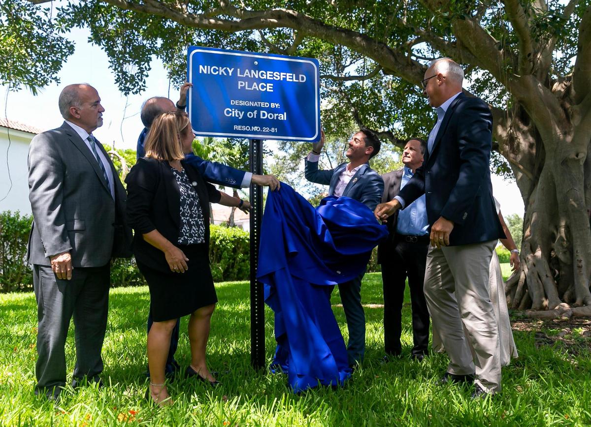 Family members of the late Nicole “Nicky” Langesfeld and City of Doral officials participate in a ceremony to honor Nicky on Wednesday, June 22, 2022 in Doral, Florida.