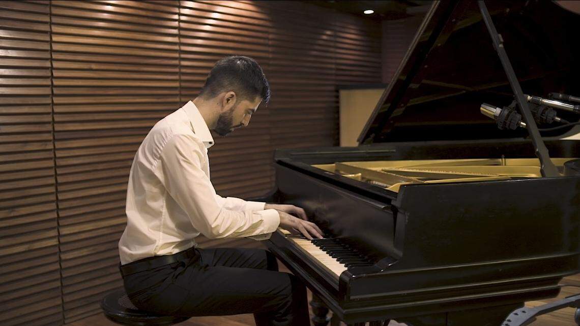 Former Royal Caribbean Group musical director Bruno Cruells plays piano in Buenos Aires, Argentina, in 2019.