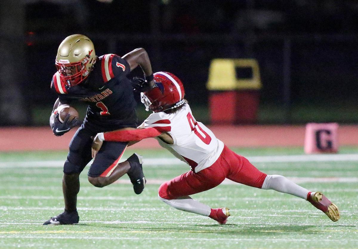 North Miami Beach Chargers defensive back John Gray (0) tackles Monsignor Pace Spartans wide receiver Willie Anderson (1) during a football game on Friday, October 25, 2024 at Monsignor Pace HS in Miami.