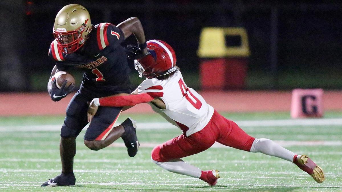 North Miami Beach Charges defensive back John Gray (0) tackles Monsignor Pace Spartans wide receiver Willie Anderson (1) during football game on Friday, October 25, 2024 at Monsignor HS in Miami. Andrew Uloza / for Miami Herald
