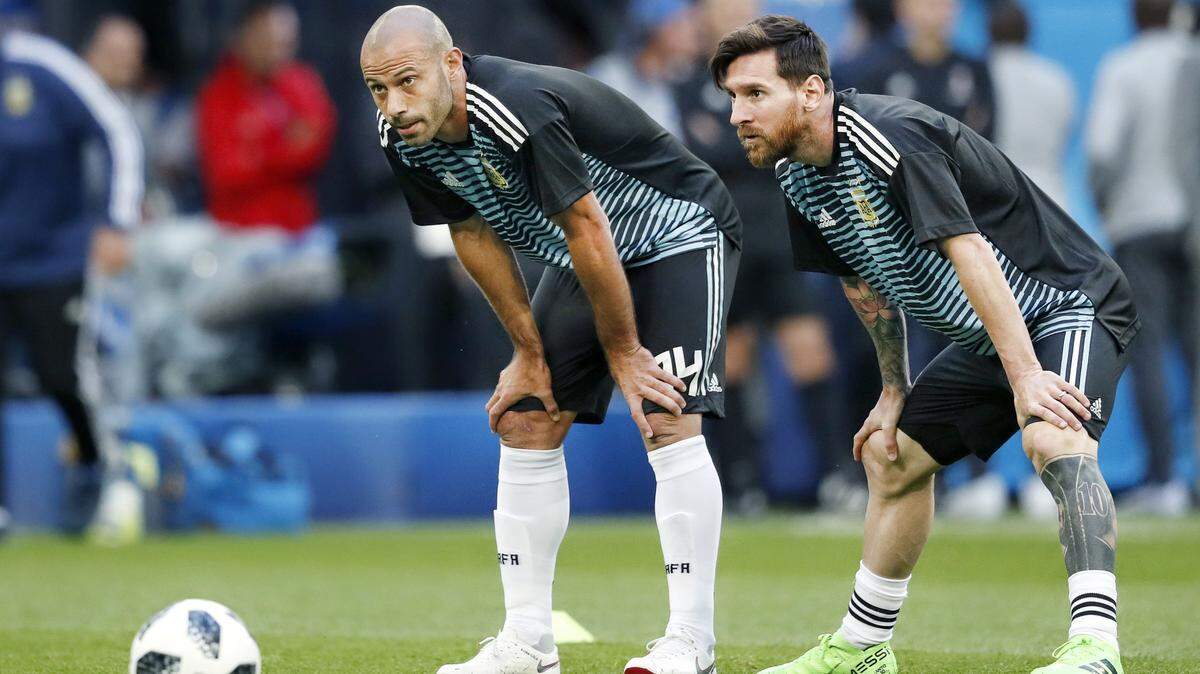 Argentina forward Lionel Messi (R) and defender Javier Mascherano (L) during a 2018 World Cup match vs. Nigeria in Saint Petersburg, Russia. They will be reunited at Inter Miami, where Messi is now the captain and Mascherano was just hired as coach to replace Tata Martino.