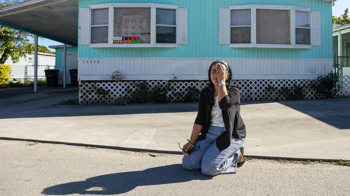 Marisol Sanchez, 55, cries in front of her former home at the Li’l Abner Mobile Home Park on Friday, March 7, 2025, in Sweetwater, Fla. She explained that her husband, Diego Valdes, who owned the mobile home and had declining health, felt pressured by developers to sell it for $14,000. She said that moments after he sold the home, he fell ill, and the next day, he passed away from a heart attack.