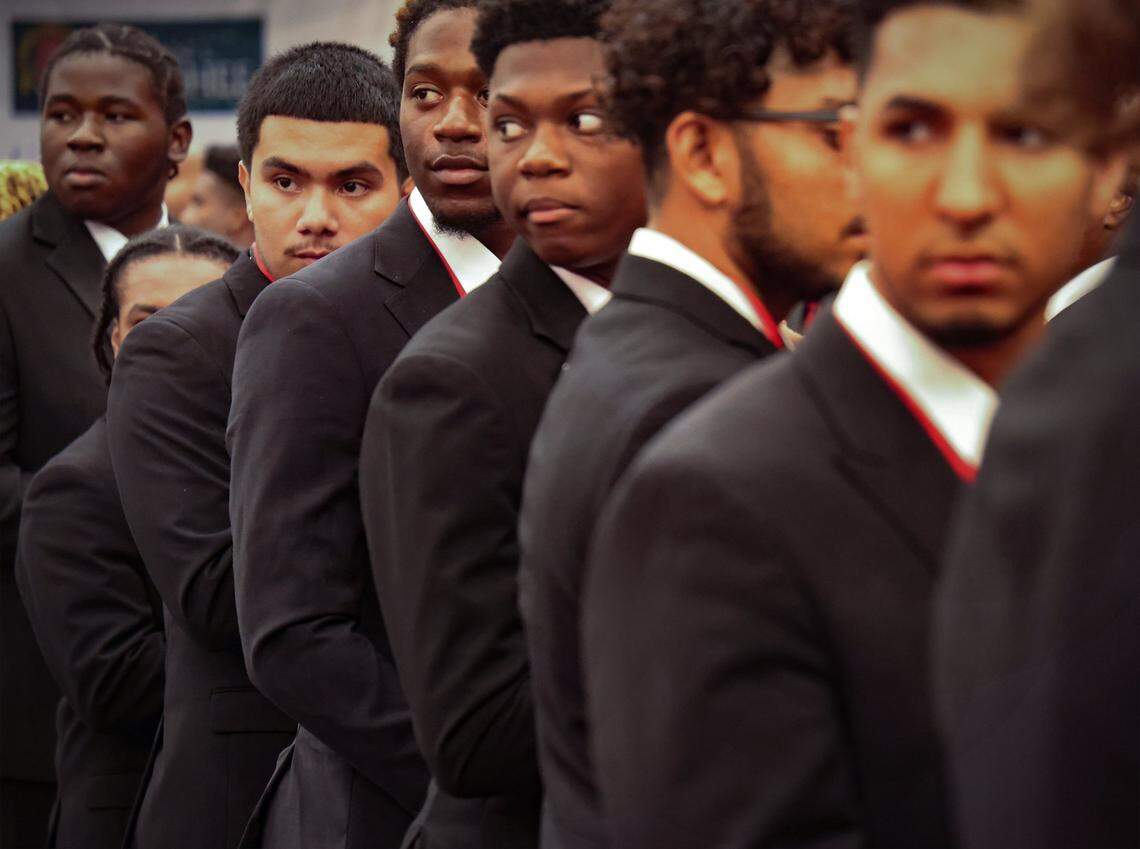 Members of the class of the 2024 Wilson Scholars look over their shoulders as the 2025 Wilson Scholars walk in the processional during the 31st consecutive year of the Wilson Scholars Academic Signing Ceremony of the 5000 Role Models of Excellence Project. Fifty Wilson Scholars from public high schools in Miami, received full scholarship support to prestigious colleges and universities during its ceremony held at the Miami Dade College-North Campus SOJ Multipurpose Room on Sunday, June 9, 2024 in Miami, Florida.