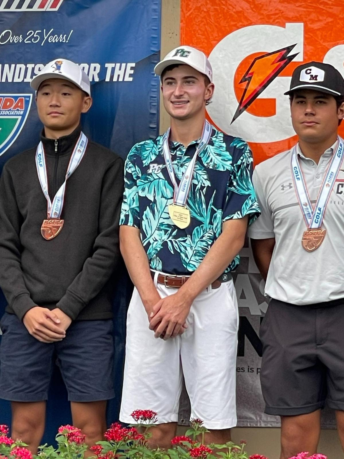 Pine Crest golfer Alexander Weinberg poses with his state championship medal after winning the Class 1A individual boys’ title on Wednesday at Howey-in-the-Hills, Fla.