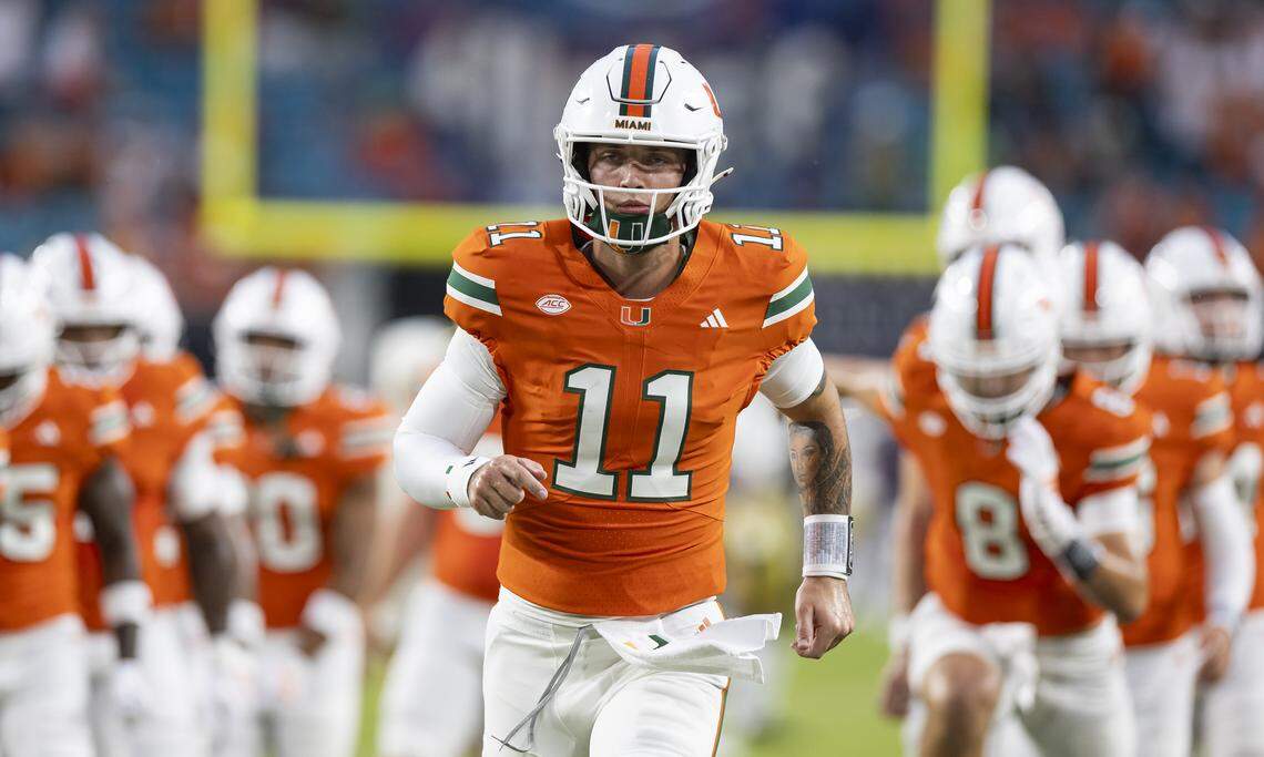 Miami Hurricanes quarterback Carson Beck (11) warms up before playing against the Notre Dame Fighting Irish in their NCAA football game at Hard Rock Stadium on Sunday, Aug. 31, 2025, in Miami Gardens, Fla.