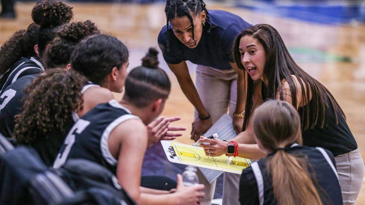 Miami Christian head coach Chanel Davila talks to the team during a timeout in the game against Faith Christian in the Class 2A girls basketball state championship game at the RP Funding Center in Lakeland on Saturday, February 26, 2022.