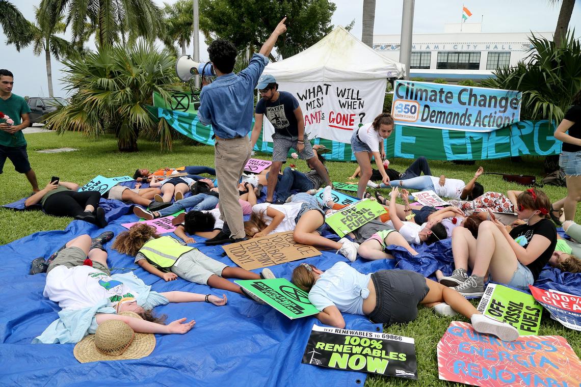 Members of the youth climate action organization Zero Hour stage a “die-in” in front of Miami City Hall on Friday as they get ready for the #ThisIsZeroHour international weekend of youth climate action July 12th - 14th, in Miami.