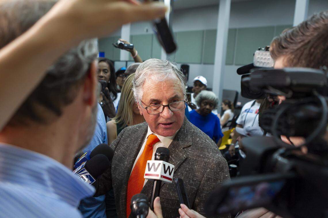 Gov. Rick Scott’s lawyer Bill Scherer, center, talks to the media after Broward County canvassing board reviewed ballots at the Broward County Supervisor of Elections office in Lauderhill, Florida on Saturday, November 10, 2018.