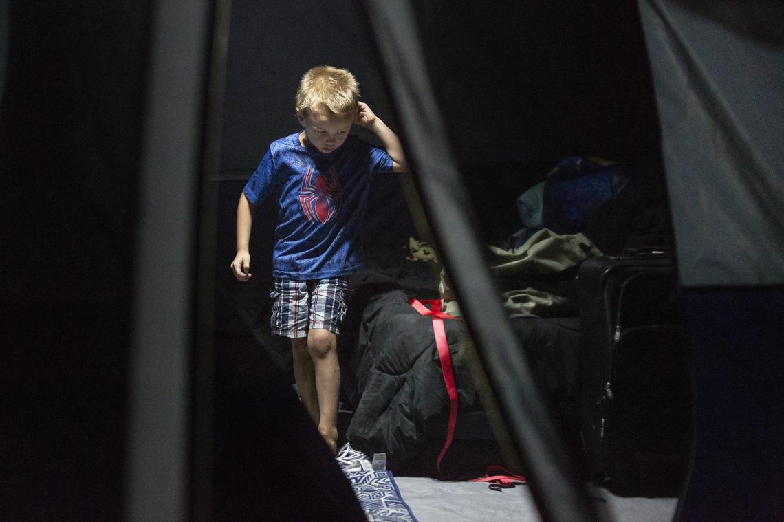 Christopher Schaefer, 4, walks through the tent he and his family are living in after Hurricane Michael on Friday, October 19, 2018. The storm devastated the Florida Panhandle leaving tens of thousands without food, power or shelter.
