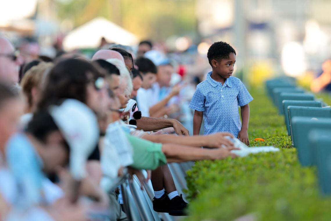 A young fans watches the race track while attending to the running of the 75th Curlin Florida Derby race at Gulfstream Park on March 28, 2026, in Hallandale, Florida.