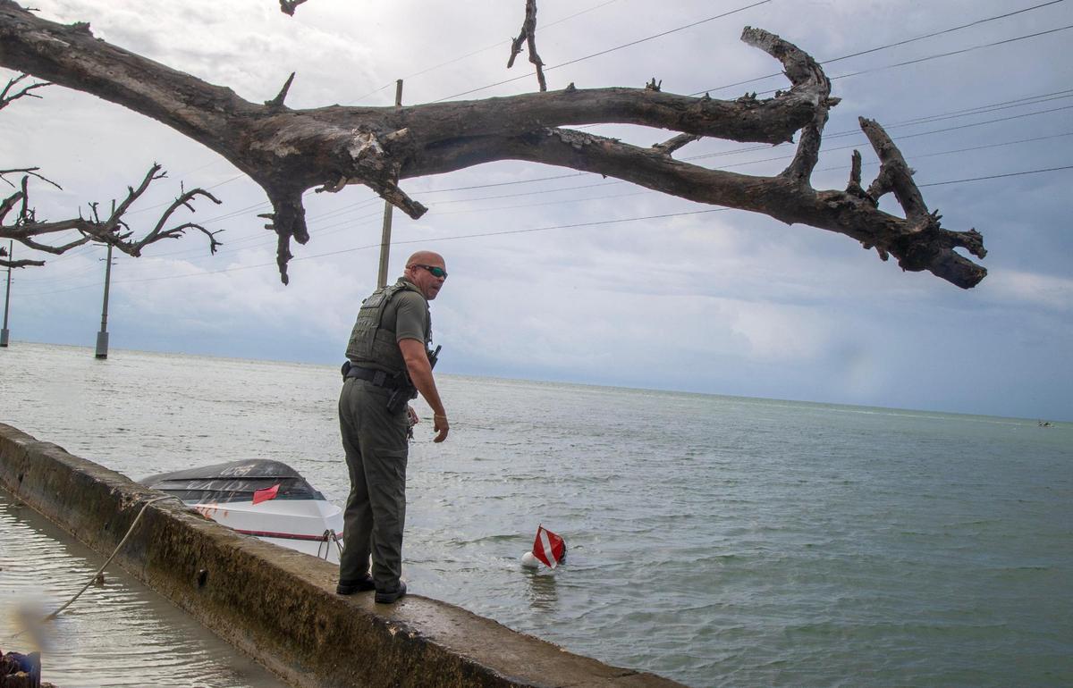 Monroe County Sheriff’s Office Marine Deputy Willie Guerra checks on a diver in the water searching for Florida spiny lobsters during the first day of lobster miniseason in the Florida Keys on Wednesday, July 26, 2023.