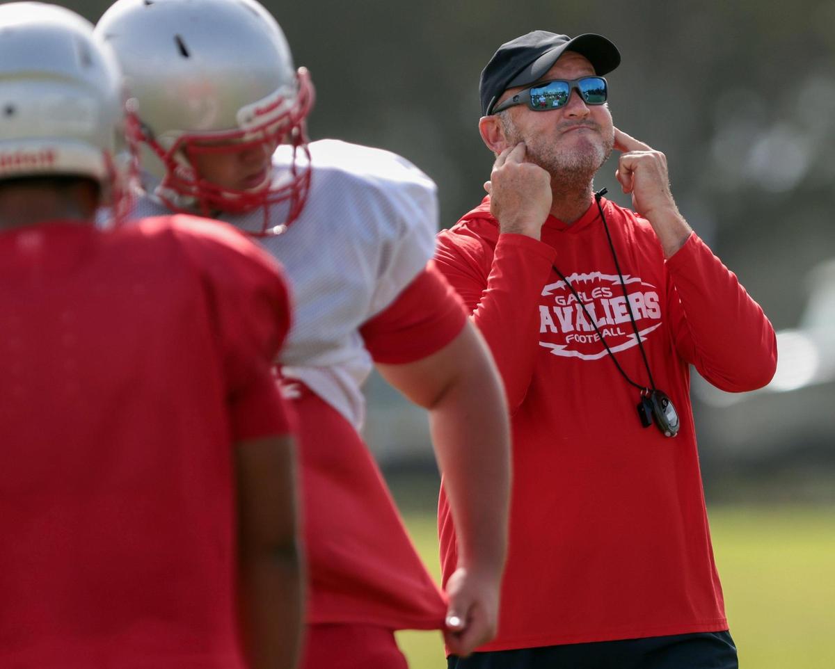 On Tuesday August 9, 2022 oral Gables High School football coach Frank Welsh, who recently has been coaching while battling colon cancer, singles to players and coaches as he conducts morning practice at Coral Gables High’s football field.