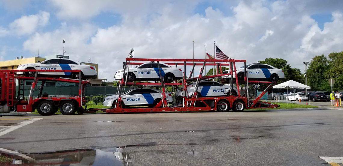 Several DHS patrol cars being delivered to the Homestead detention center in July.