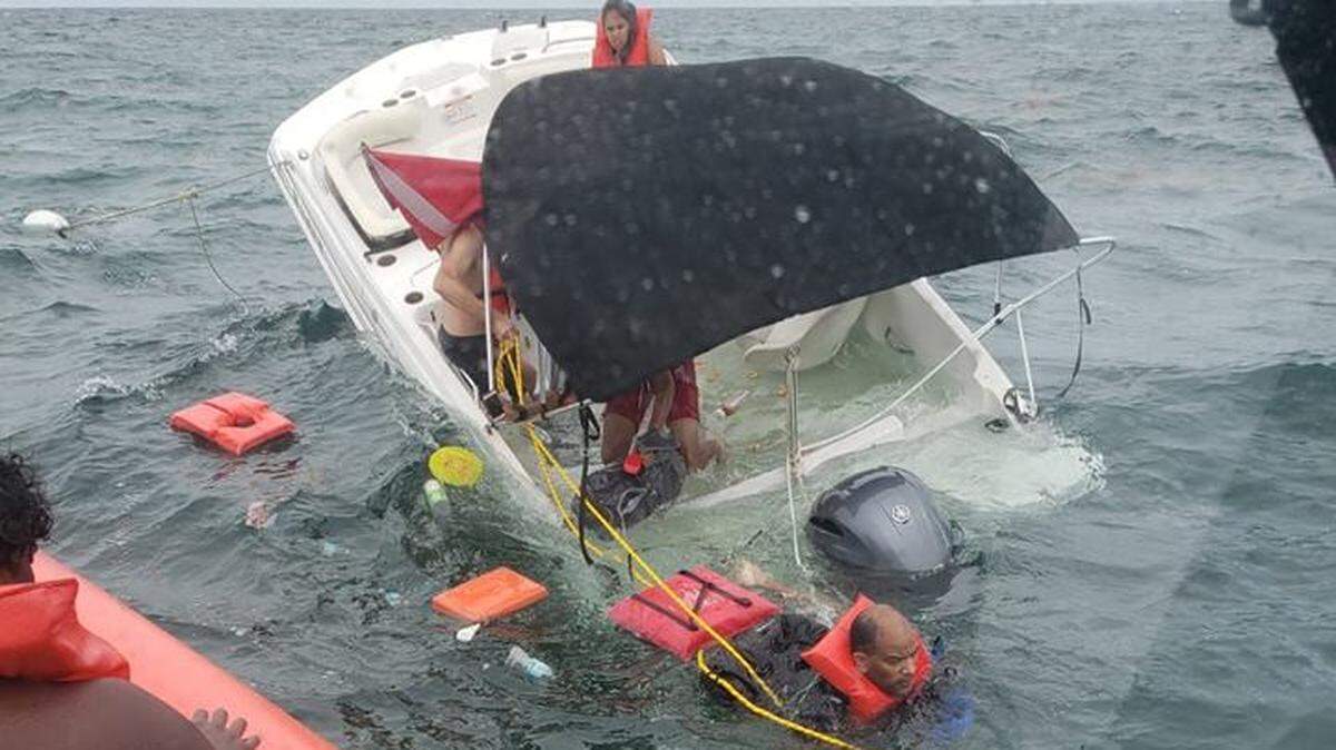A 19-foot vessel goes down off the coast of Islamorada Thursday, July 5, 2018, after crews from Coast Guard Station Islamorada rescued all nine passengers.