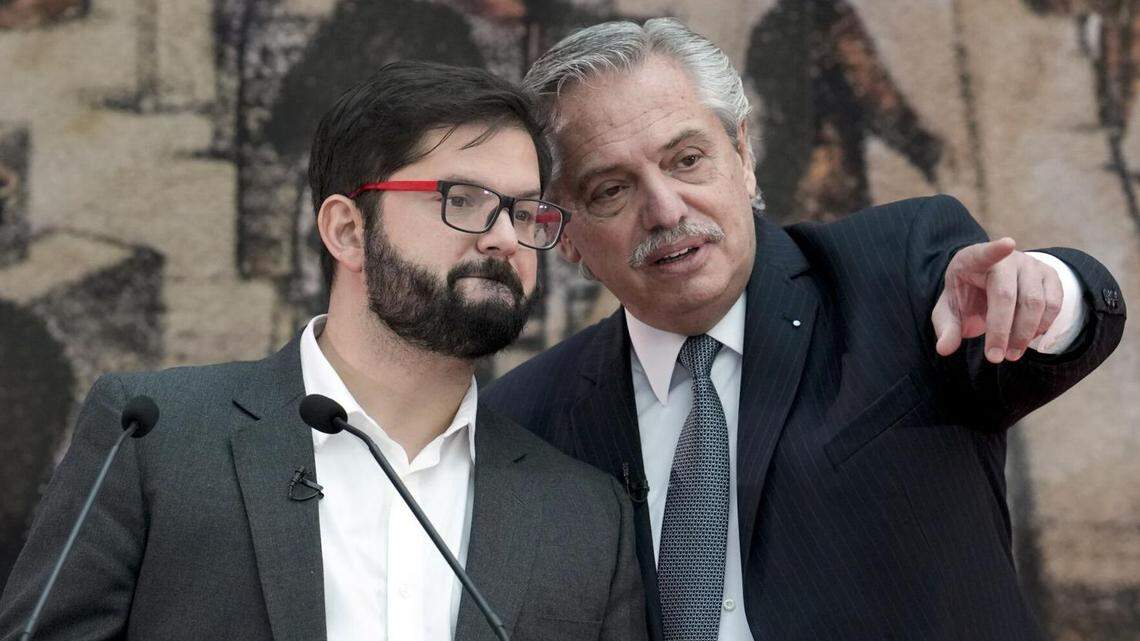 Chilean President Gabriel Boric, left, and Argentine President Alberto Fernandez talk before signing agreements in Buenos Aires, Argentina, in April.