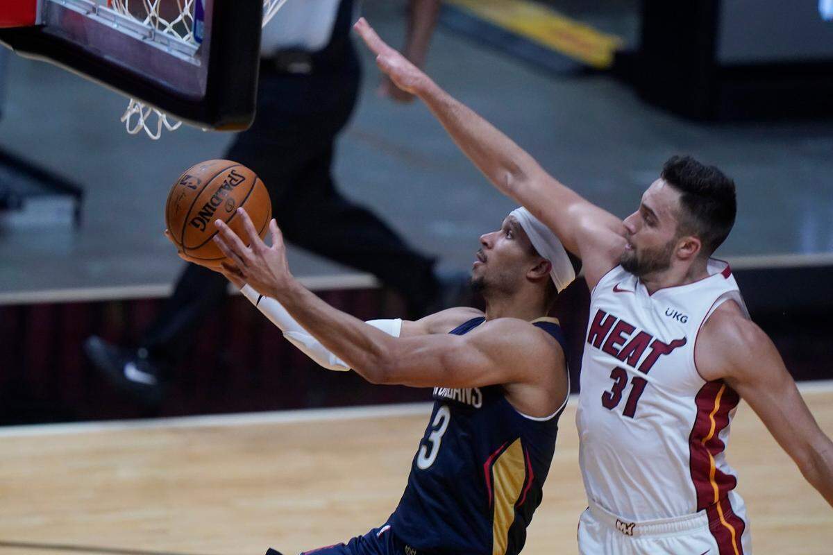 New Orleans Pelicans guard Josh Hart (3) goes up for a shot against Miami Heat guard Max Strus (31) during the second half of a preseason NBA basketball game, Monday, Dec. 14, 2020 at AmericanAirlines Arena.