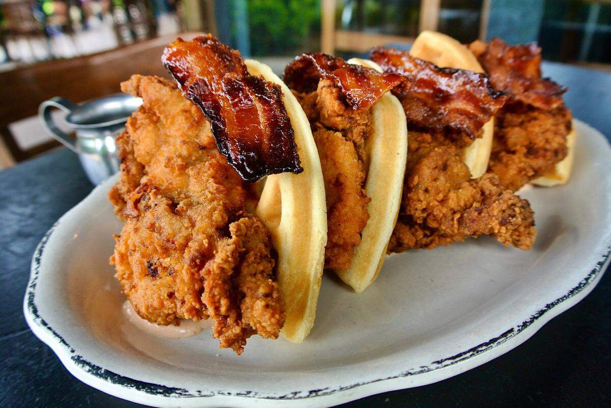 Chicken and waffles with candied bacon at Eating House