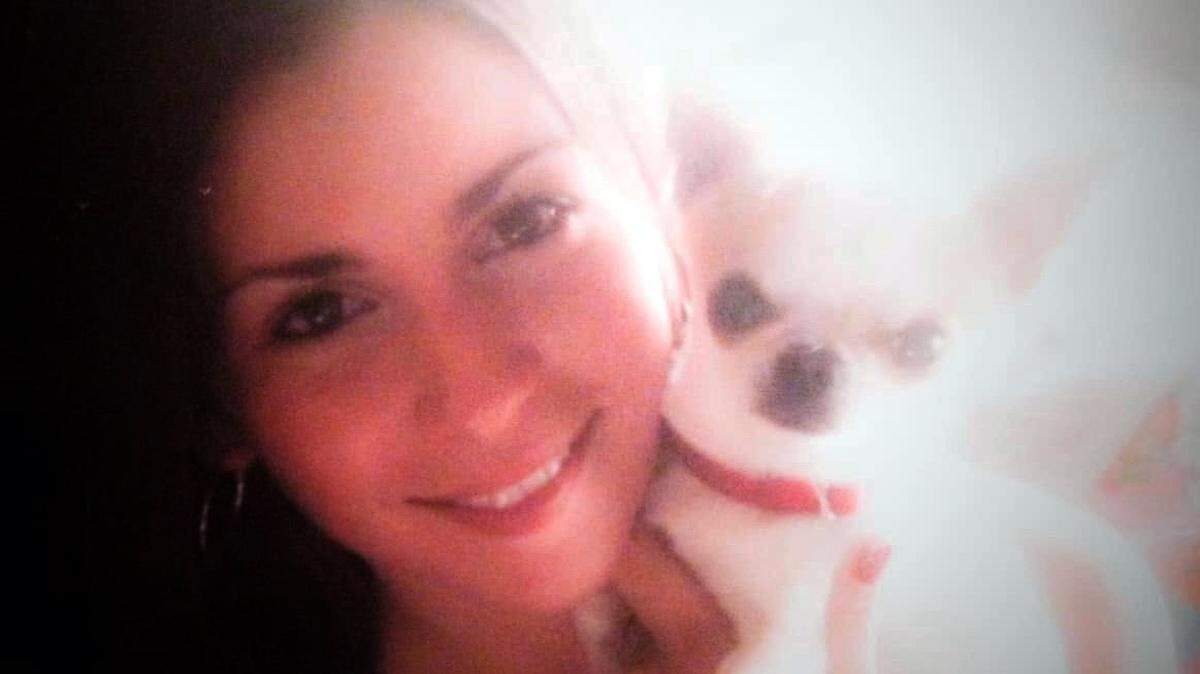 Nicole LaDue holds her dog Mickey before he was killed in 2005 by her abuser, LaDue said. (Contributed/Fresh Take Florida)