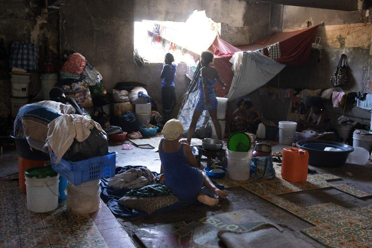 Internally displaced people take refuge in the remains of the National Theatre, which was destroyed by the 2010 earthquake that killed more than 200,000 Haitians.