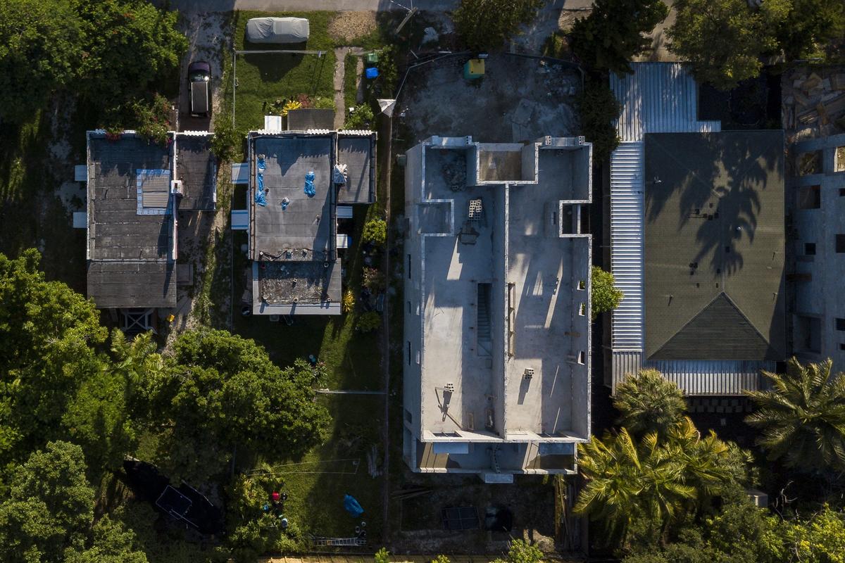 An aerial view of properties located in the 3100 block of Ohio Street in the West Grove shows how the new houses are built to occupy a much larger footprint than the old ones.