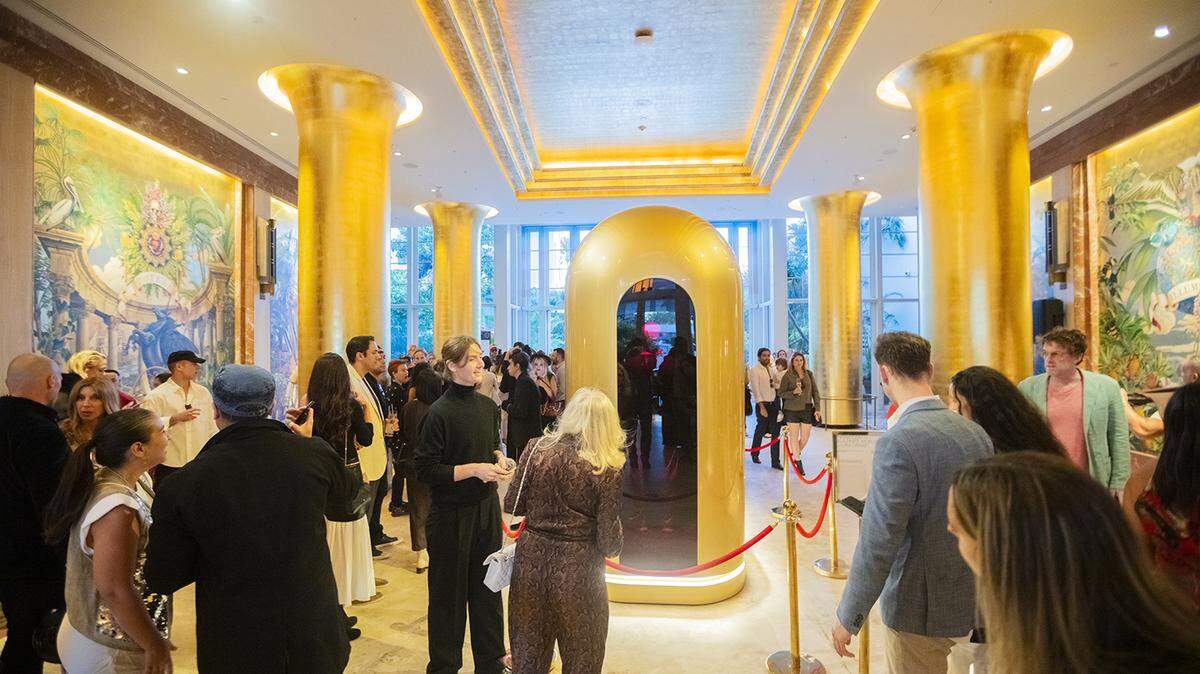 Lyra Drake’s artwork titled Infinite Faith in a Finite World, featuring an AI-based sculpture, explores philosophical and existential questions about faith, human connection, and the environment. It’s located in the Faena hotel lobby in Miami Beach.