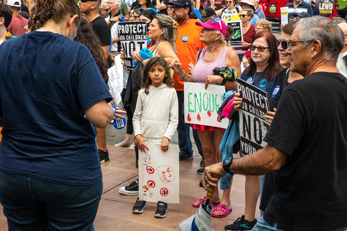 About 200 people from March for Our Lives and Moms Demand Action gathered in front of City Hall on Sat., Jun. 11, 2022 in Coral Gables, Fla. to advocate for gun control.