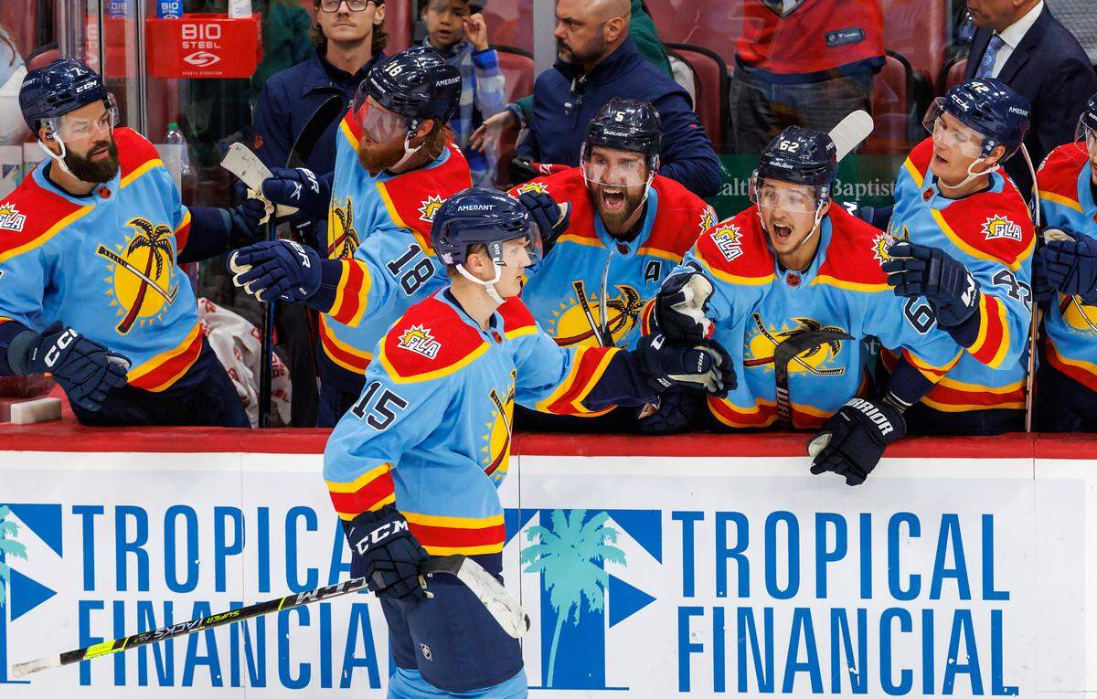 Florida Panthers center Anton Lundell (15) celebrate with the bench after scoring scores a goal during shootout of an NHL game against Calgary Flames at FLA Live Arena on Saturday, November 19, 2022 in Sunrise, Fl.