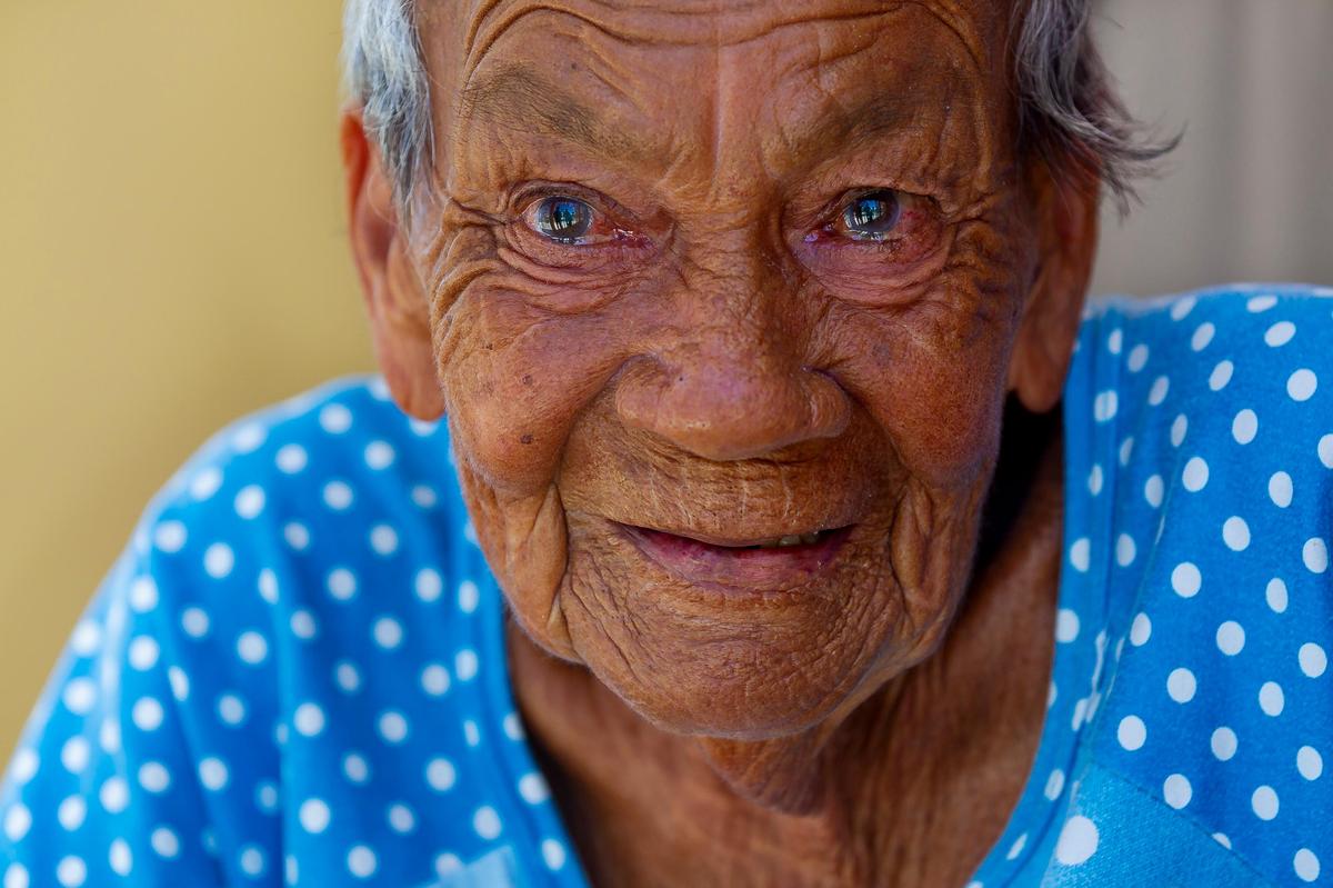 Lidia M. Rodriguez, 79, who is blind, was trapped in her home in Punta Santiago, Humacao by rising seawater during Hurricane Maria last year. A year later, Rodriguez lives with her family as they rebuild their home.