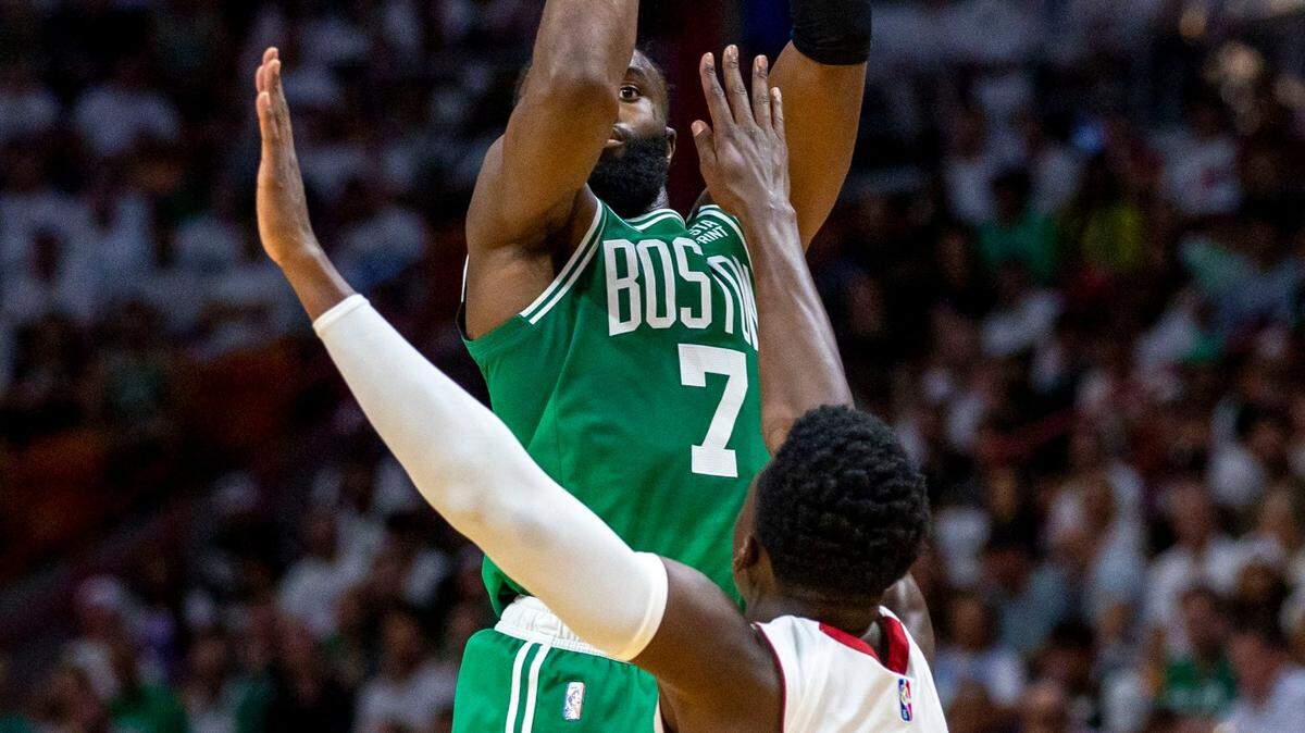Boston Celtics guard Jaylen Brown (7) shoots over Miami Heat point guard Victor Oladipo (4) during the second quarter of Game 2 of the NBA Eastern Conference Finals series at FTX Arena in Miami, Florida, on Thursday, May 19, 2022.
