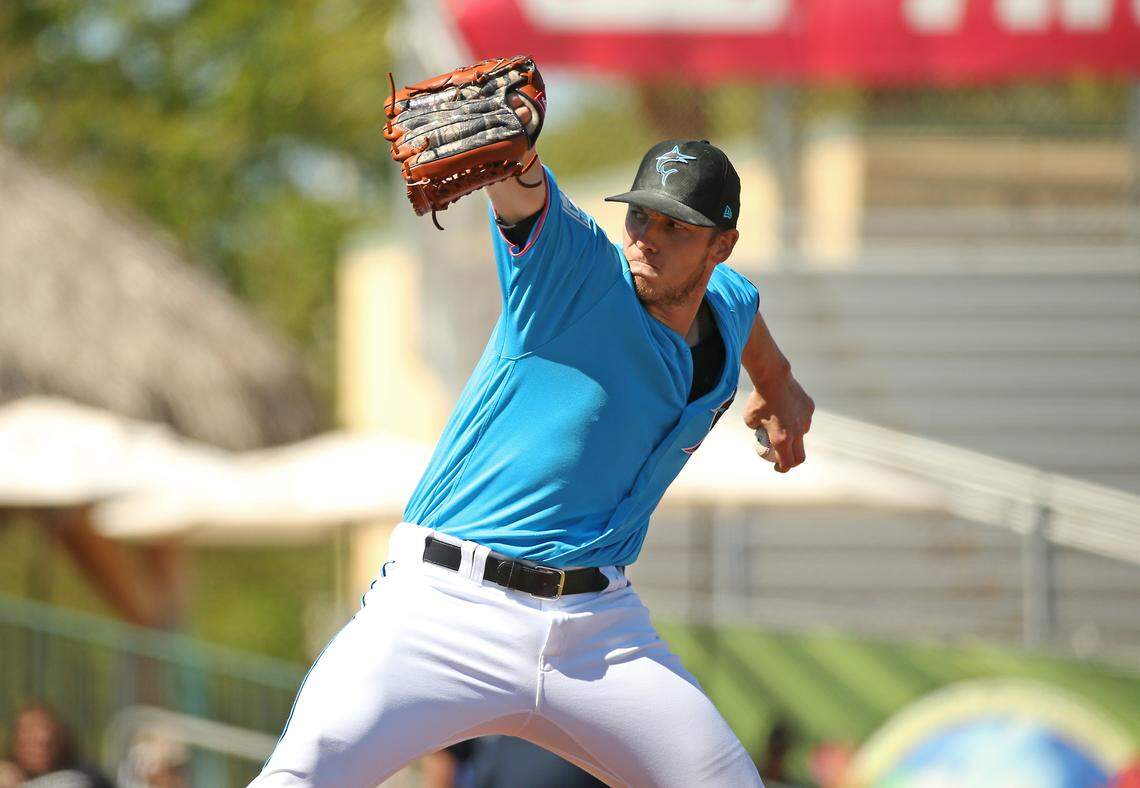 Miami Marlins pitcher Adam Conley (61) pitches during the fourth inning of a Major League Baseball spring training game against the Atlanta Braves at the Roger Dean Chevrolet Stadium on Wednesday, March 6, 2019 in Jupiter, FL.