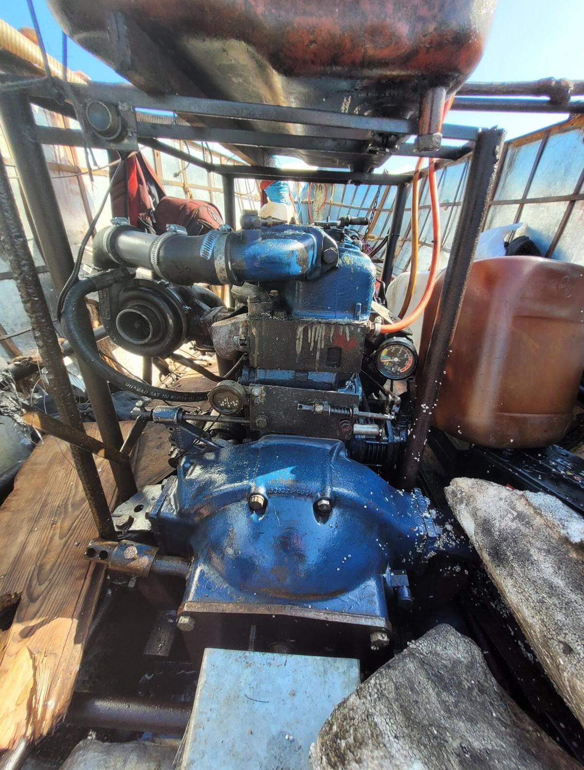 A car engine is mounted in the middle of a homemade wooden vessel that carried 29 Cuban migrants to Conch Key in the Florida Keys Wednesday, March 9, 2022.