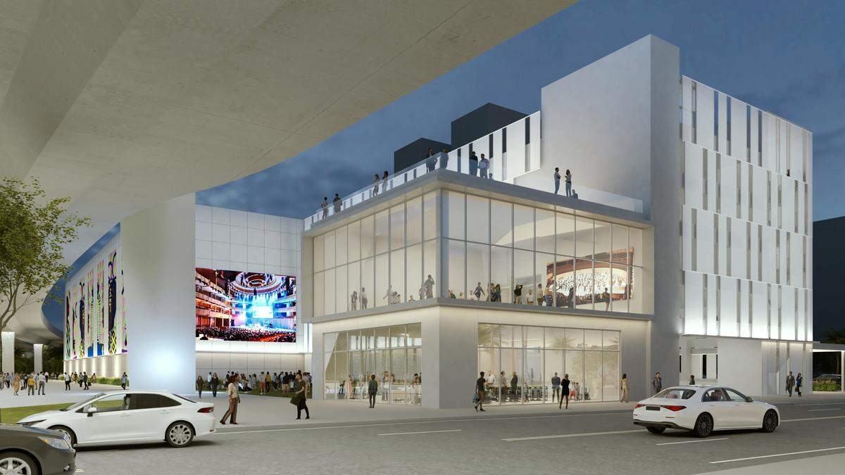 Una representación muestra el posible aspecto de un aparcamiento propuesto para el Arsht Center for the Performing Arts adosado a un nuevo tramo oeste completado de la Interestatal 395, a la izquierda. El aparcamiento de 750 plazas también incluiría dos estudios, en el centro, una plaza detrás de estos y obras de Art in Public Places.