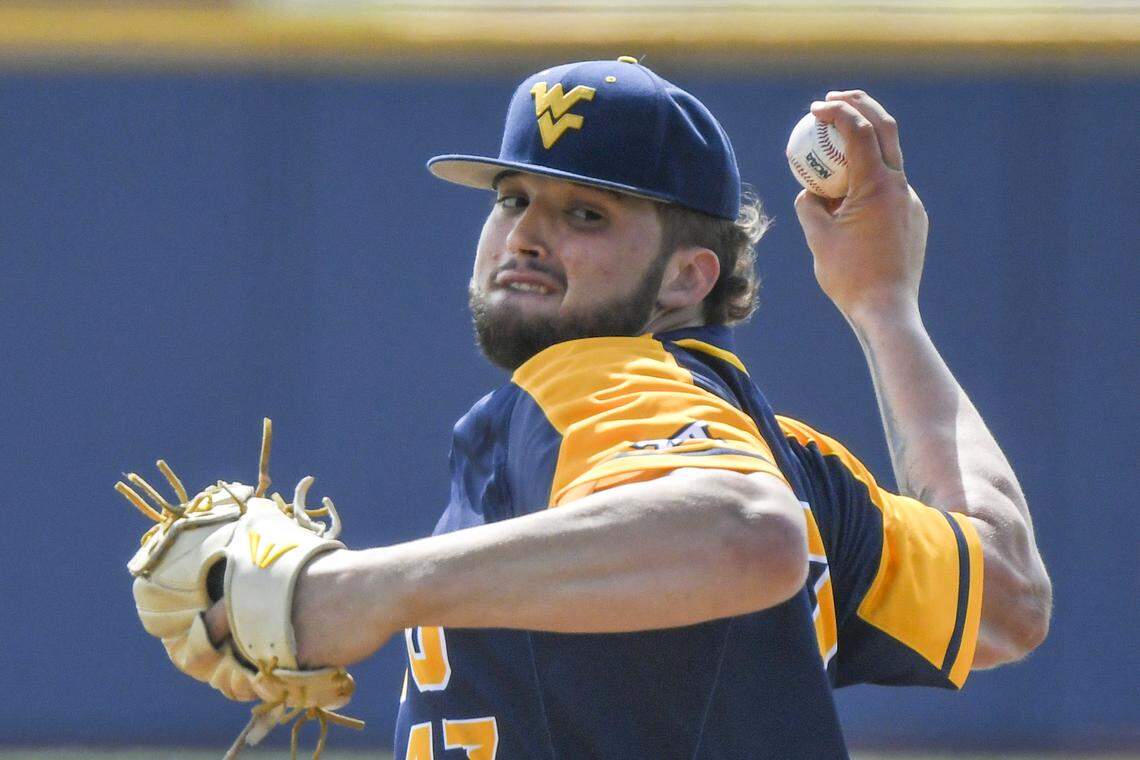“Sometimes an ump will whisper in my ear: ‘They’re not going to hit [Alek Manoah, above],’” WVU catcher Ivan Gonzalez said. “’They have no chance.’”