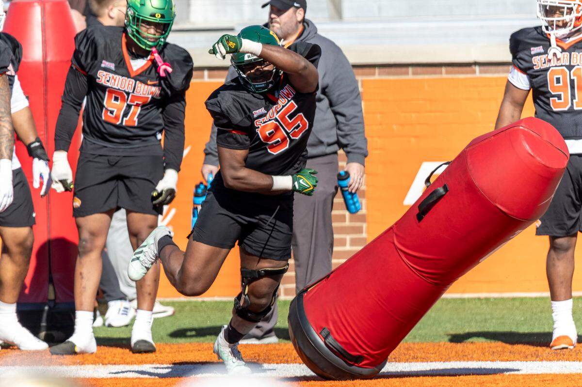Jan 30, 2024; Mobile, AL, USA; National defensive lineman Gabe Hall of Baylor (95) works out on practice dummies during practice for the National team at Hancock Whitney Stadium. Mandatory Credit: Vasha Hunt-USA TODAY Sports