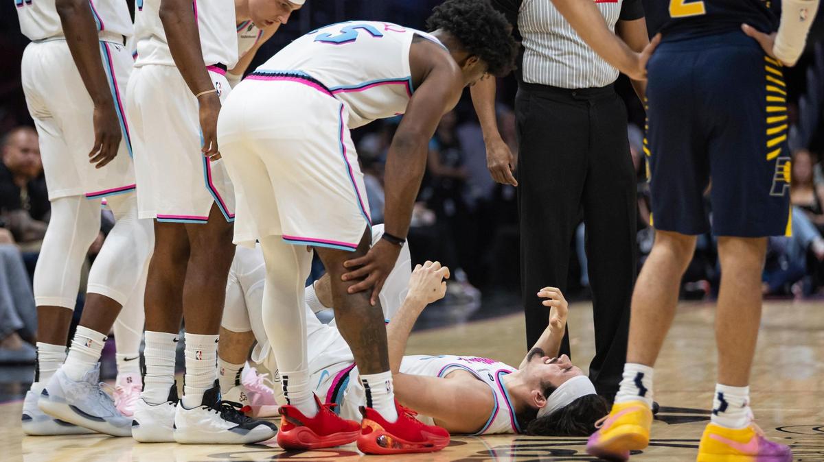 Miami Heat guard Jaime Jaquez Jr. (11) reacts after sustaining an injury in the second half of his NBA game against the Indiana Pacers at Kaseya Center on Feb. 28, 2025, in Miami.