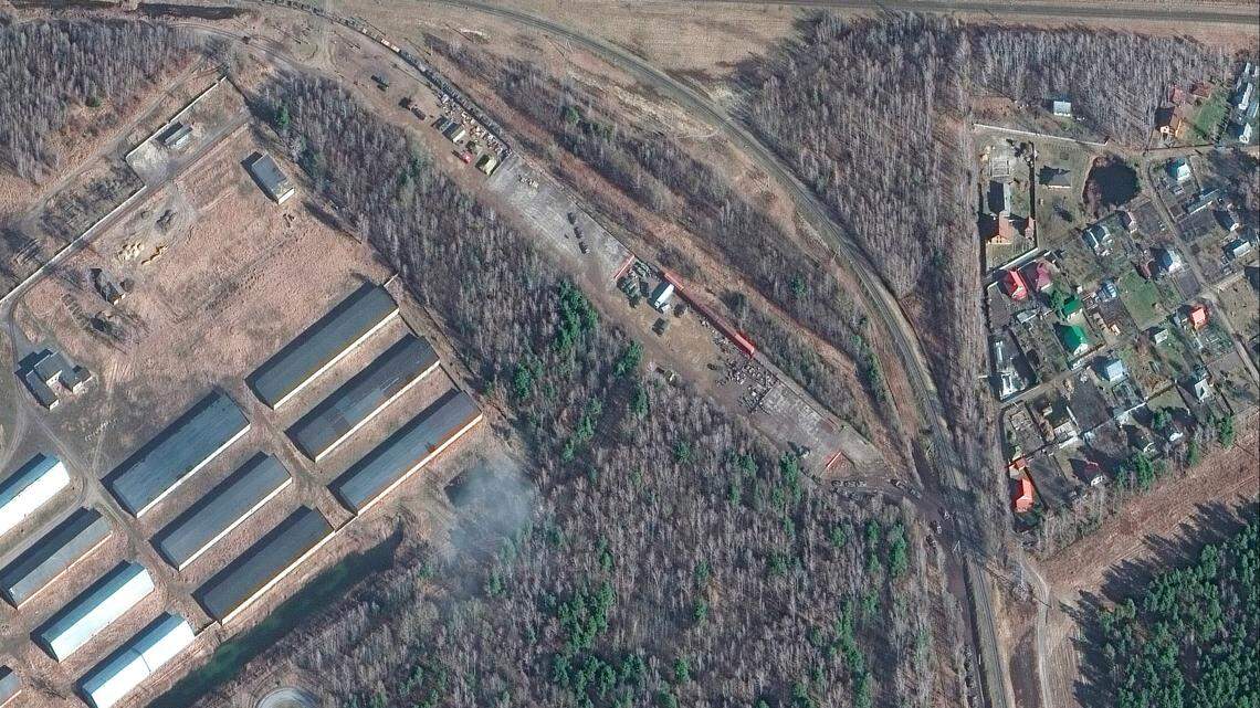 This Thursday, Feb. 24, 2022, satellite image provided by Maxar Technologies shows armor and equipment at a railyard near Brest, Belarus.