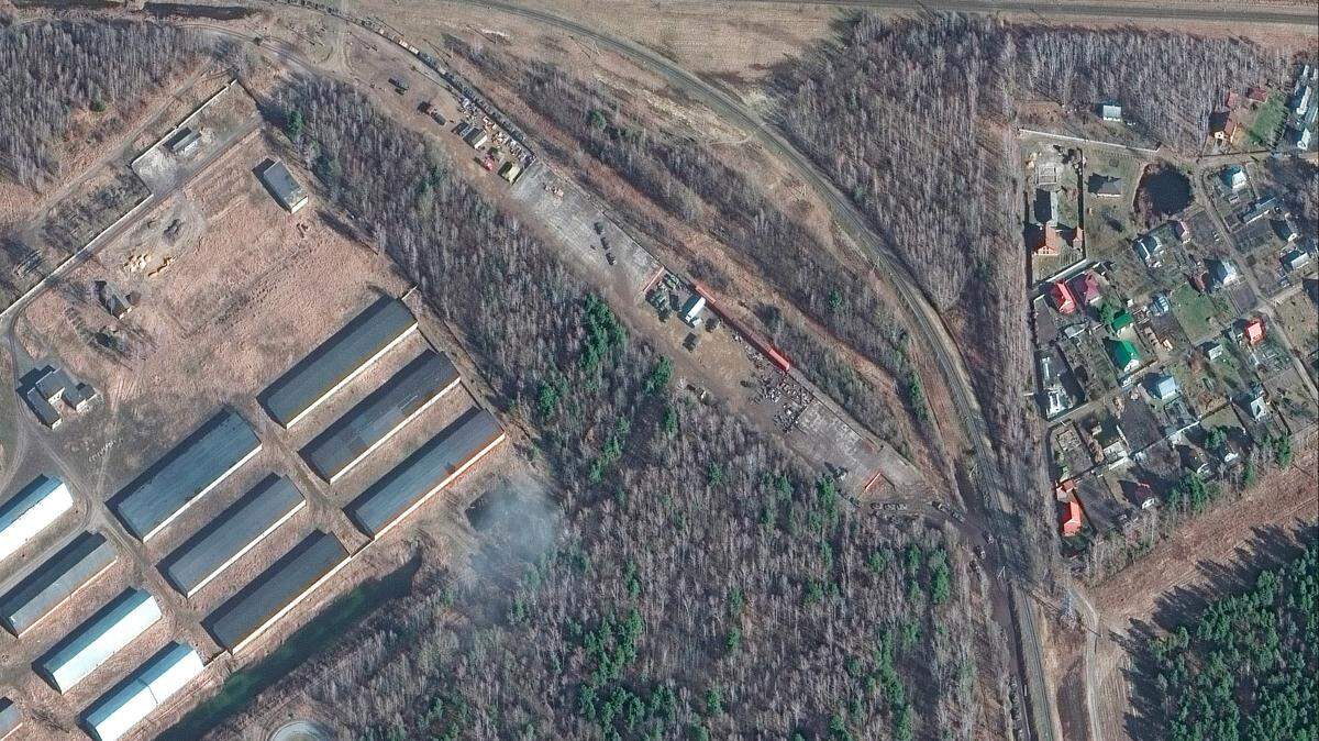 This Thursday, Feb. 24, 2022, satellite image provided by Maxar Technologies shows armor and equipment at a railyard near Brest, Belarus.