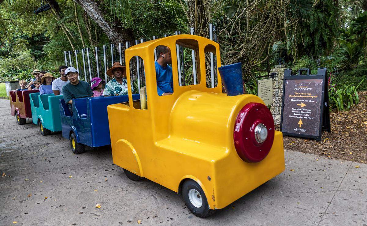 Visitors take a tram tour at Fairchild Tropical Botanic Garden in 2024.