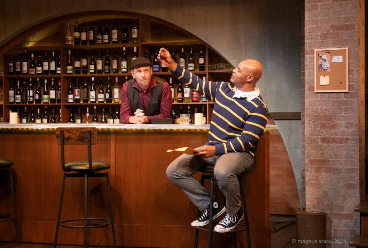 Gregg Weiner as Matt and Melvin Huffnagle as Shawn at a Cleveland wine bar in a scene from GableStage’s “King James.”