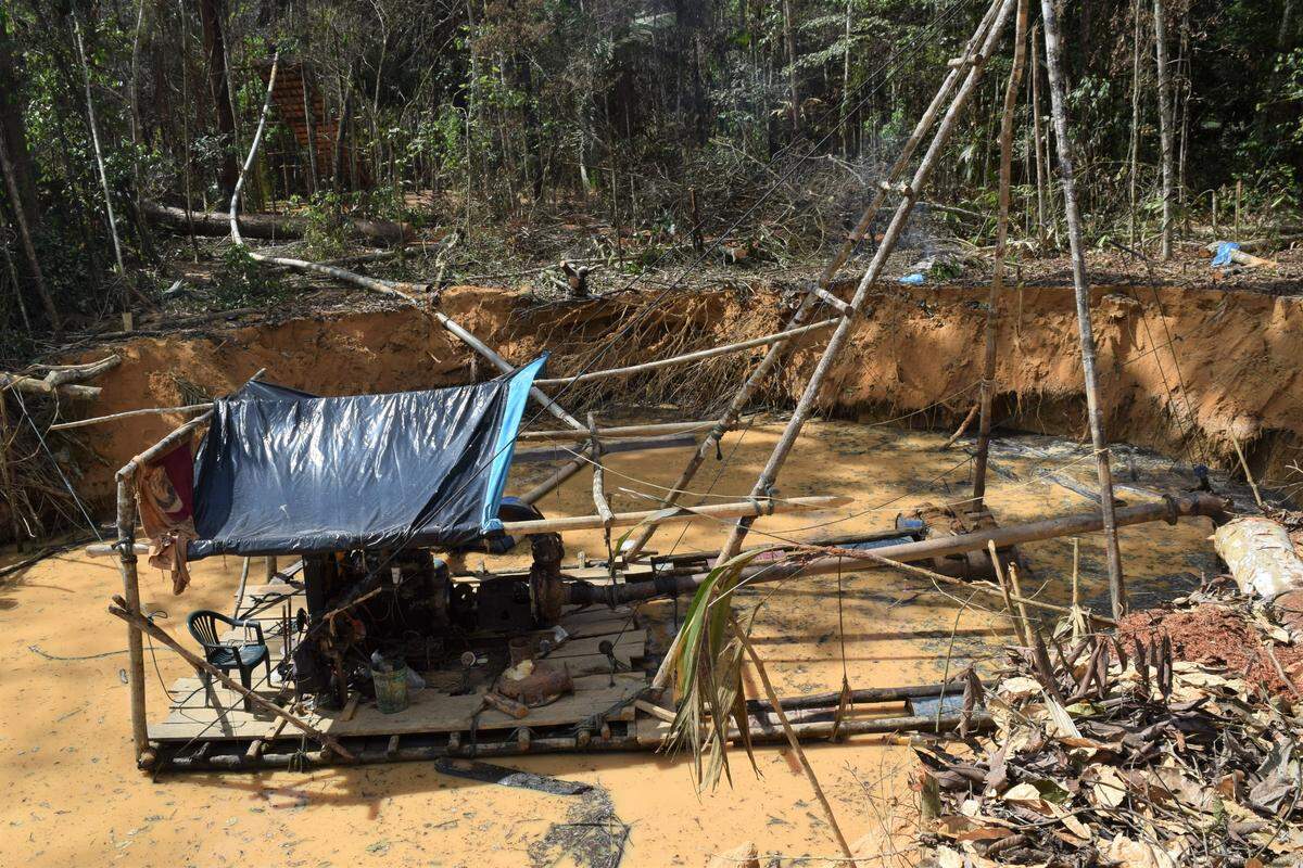 A gold mining barge works in an area close to La Pampa, once one of Peru’s largest illegal gold mines. When La Pampa was shutdown earlier this year, some 30,000 to 40,000 people lost their ability to make an income and many have punched into other areas to continue mining.