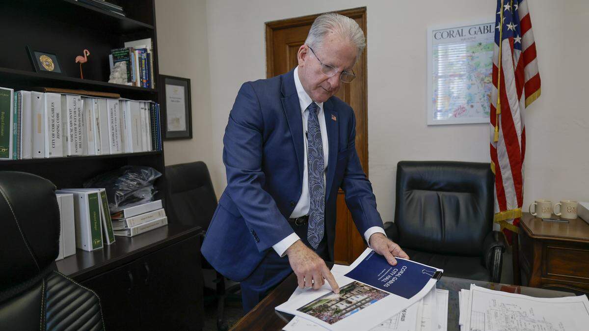 Coral Gables City Manager Peter J. Iglesias looks through renovation and restoration plans at City Hall on Wednesday, March 4, 2026.