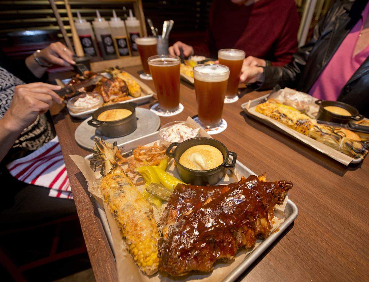 Dinner entrees on the Carnival Horizon at Guy’s Pig & Anchor Smokehouse|Brewhouse. The venue serves up barbecue favorites created by Food Network star Guy Fieri, as well as four new craft beers brewed on board.