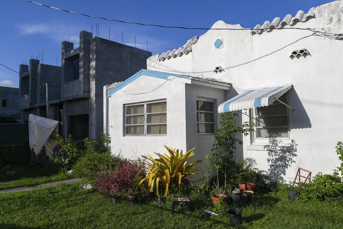 This 1926 West Grove house on Ohio Street, owned by a longtime resident, sits next to a house being constructed with a side setback that appears to be in violation of Miami’s zoning code.