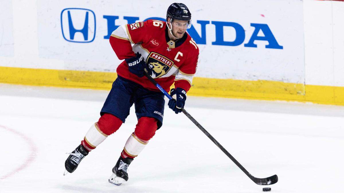 Florida Panthers center Aleksander Barkov (16) controls the puck as he looks down the ice during the second period of an NHL game against the Montreal Canadiens at Amerant Bank Arena on Sunday, March 30, 2025, in Sunrise, Fla.